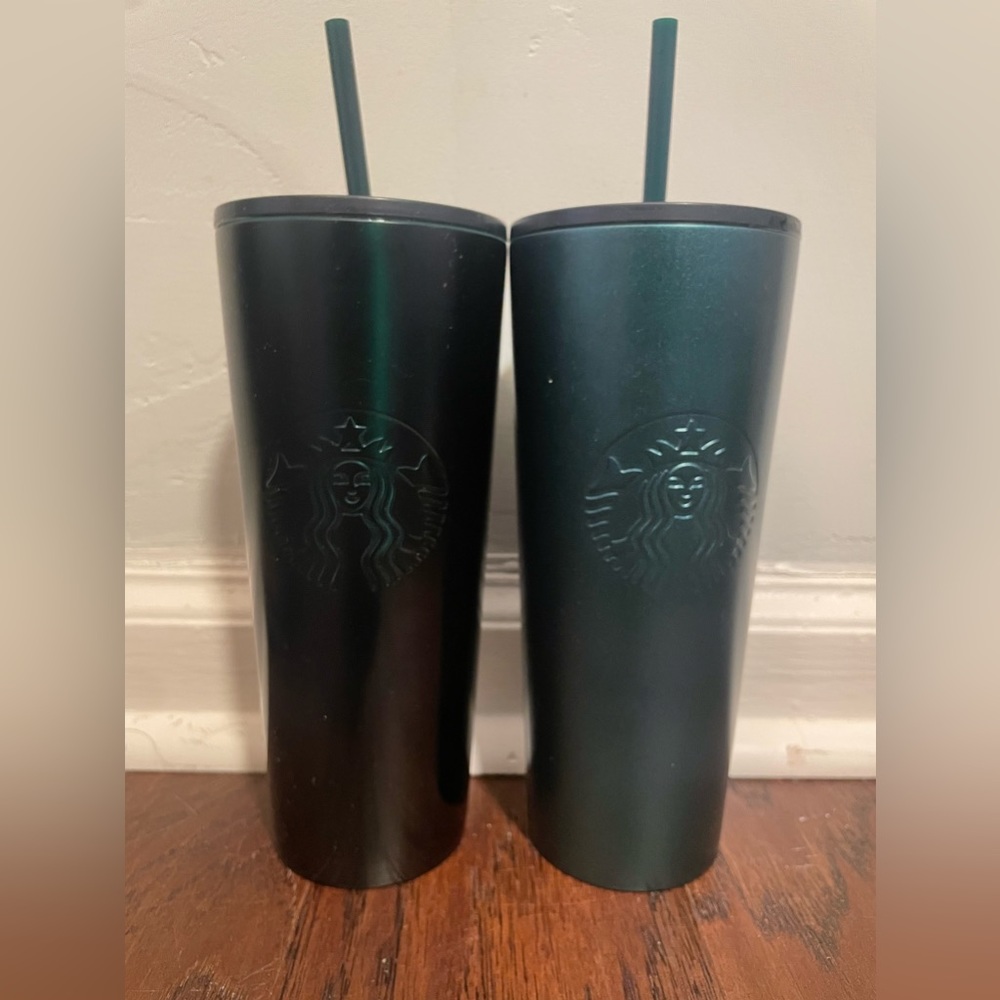 Two green limited edition Starbucks cups